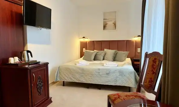 Habitación doble con cama adicional en Willa